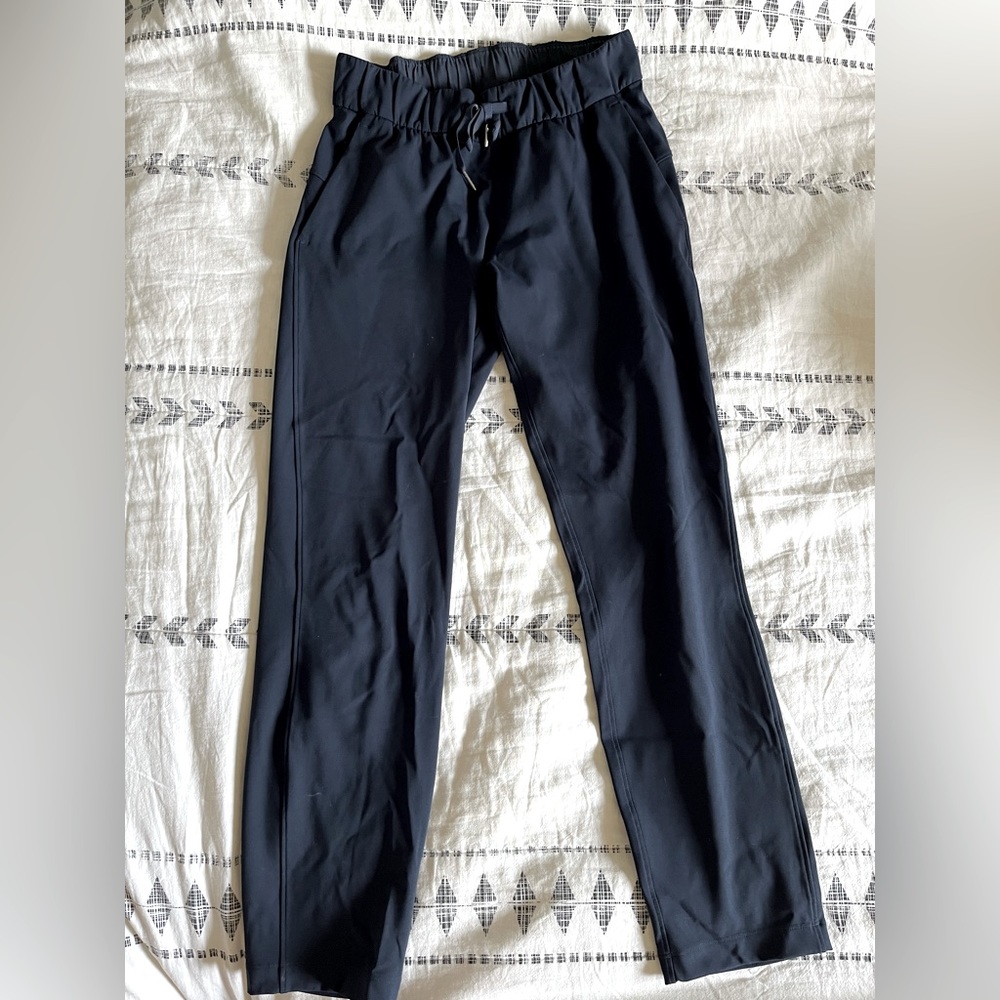 Navy lululemon on the fly 7/8 pants, size 4